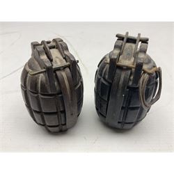 Two inert WW2 Mills Bomb (pineapple) hand grenades; one adapted as a money box with coin slit to the side and later cap H9.5cm (2)