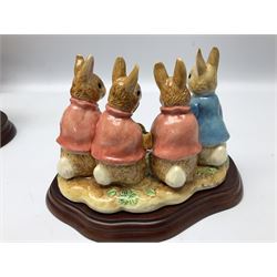 Four Border Fine Arts Beatrix Potter figures, comprising Tableau created to commemorate the Millenium together with a Border Fine Arts Limited Edition no 669814, The Tale of Peter Rabbit Tablet A1306, Four Little Rabbits A2442 and Sailing Home A2443