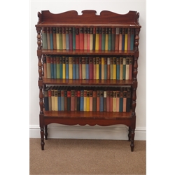  19th century mahogany four tier bookcase, containing novels by Irwin Shaw, Gerald Hanley, Rebecca West and others in eighty-one vols, printed by The Reprint Society, 1958   