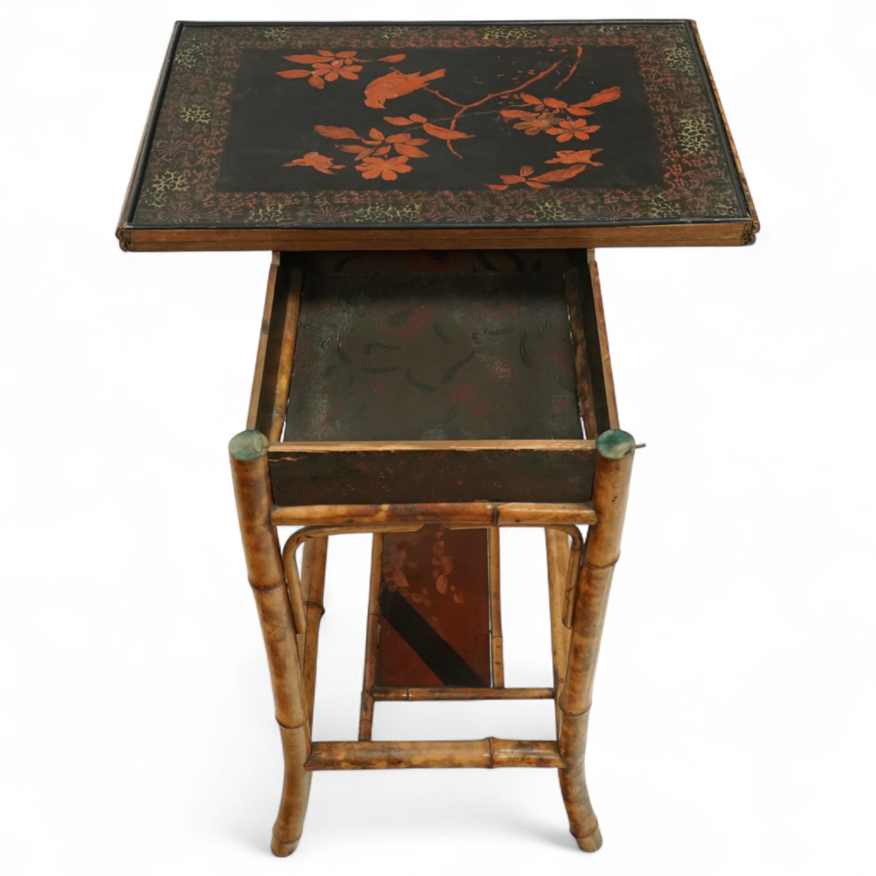Late Victorian bamboo and lacquered card table, the top decorated with birds and floral sprays, hinged to reveal a baize playing surface, on bamboo effect legs with lacquered undertier