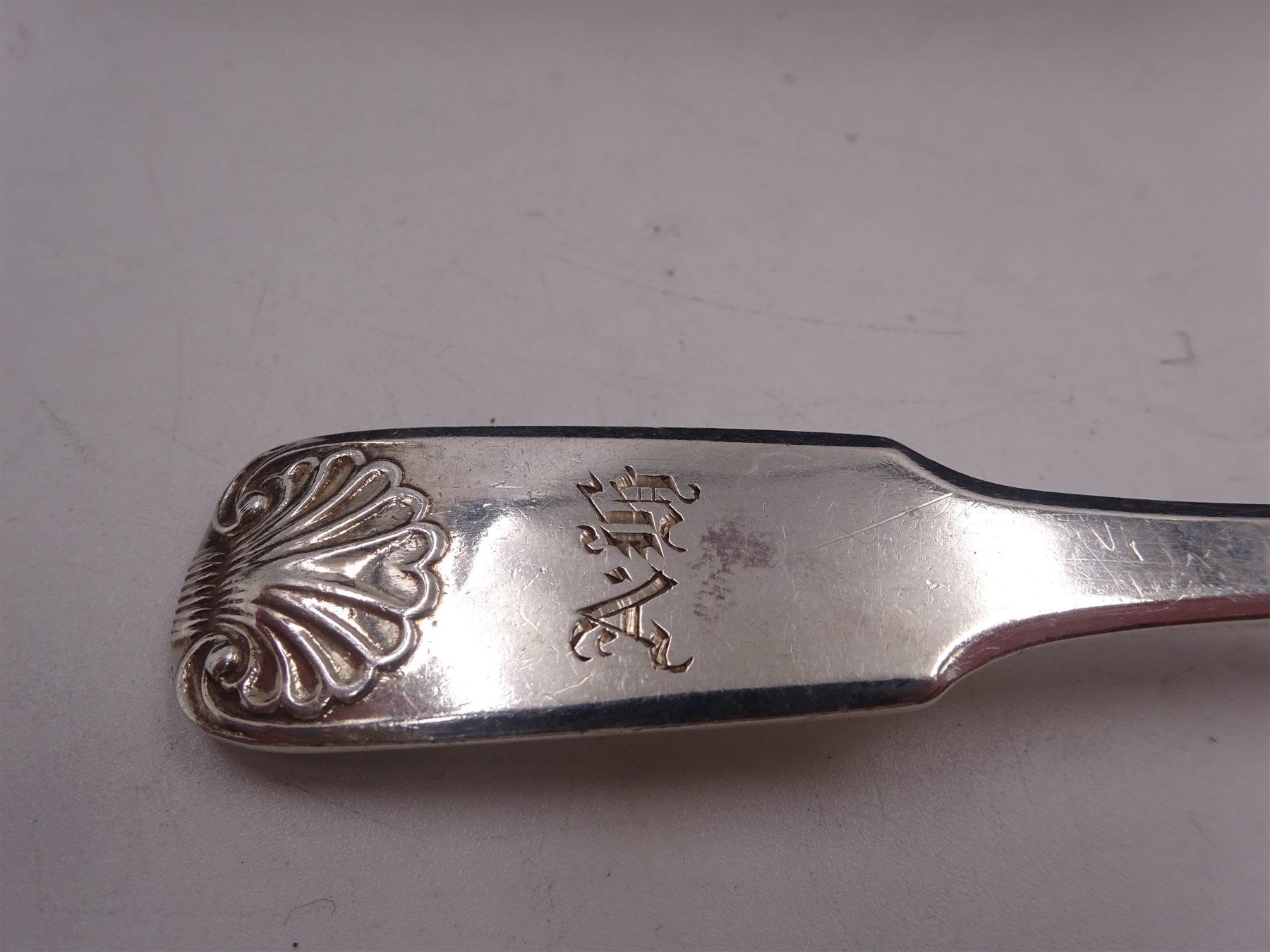 Set of six George IV York silver Fiddle Shell pattern teaspoons, each with engraved initials, hallmarked Edward Jackson, York 1821