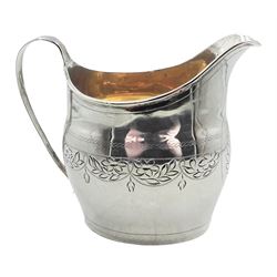 Georgian silver cream jug, of oval form with bright cut engraved foliate decoration and gilt interior, hallmarked London, makers mark and date letter worn and indistinct, approximate weight 3.50 ozt (109 grams)