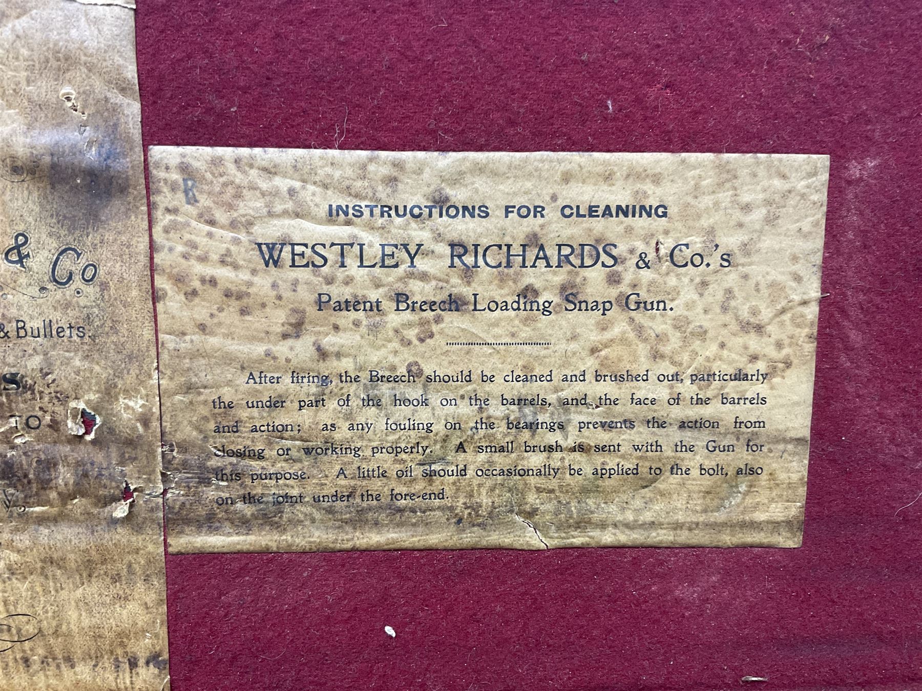 Leather shotgun case, the red baize lined interior with the trade labels of Westley Richards & Co., London, a brass plaque inscribed 'T Nevin, Mirfield, Yorkshire' to cover, with key, case to fit barrel 76cm (30 inches)  
