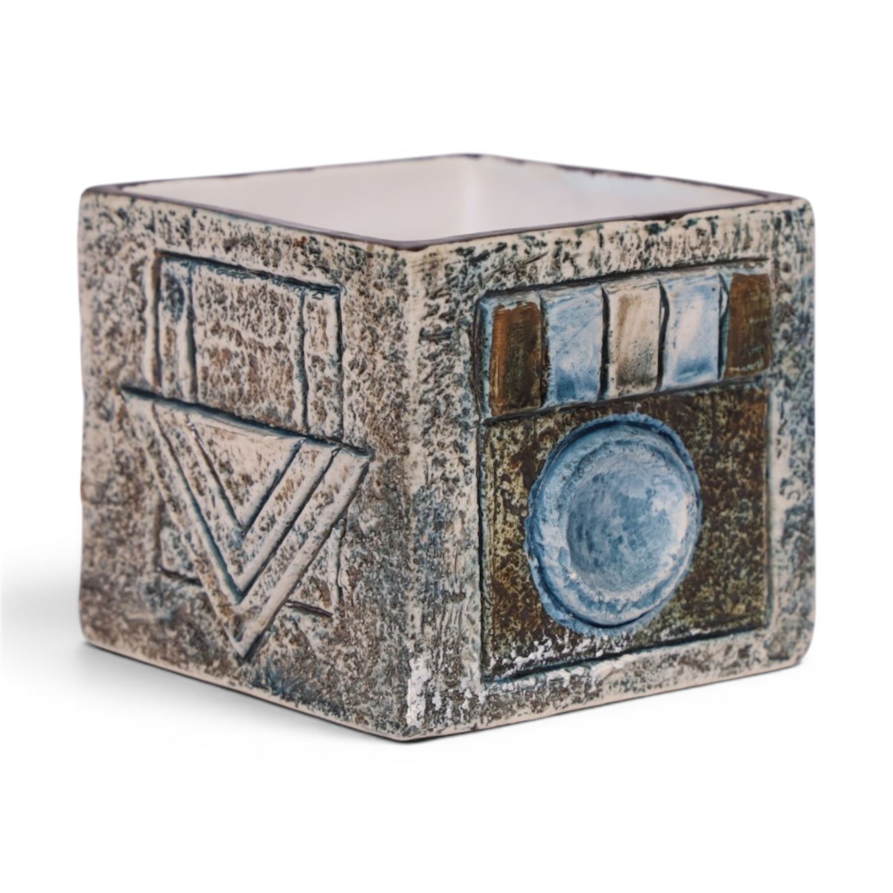 Troika cube vase by Anne Lewis, with geometric incised decoration in blue on a mottled blue ground, signed to base with initials