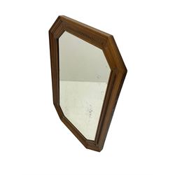 Edwardian oak framed octagonal wall mirror, bevelled plate with beading design 