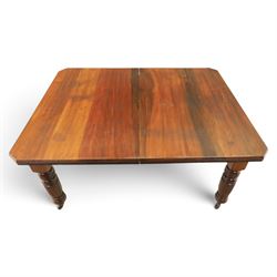 Victorian mahogany extending dining table and four chairs, rectangular top with moulded edge, extended to 198cm with additional leaf and winder, fluted and turned supports raised on castors, the chairs with swept frame and overstuffed seat, raised on cabriole front supports