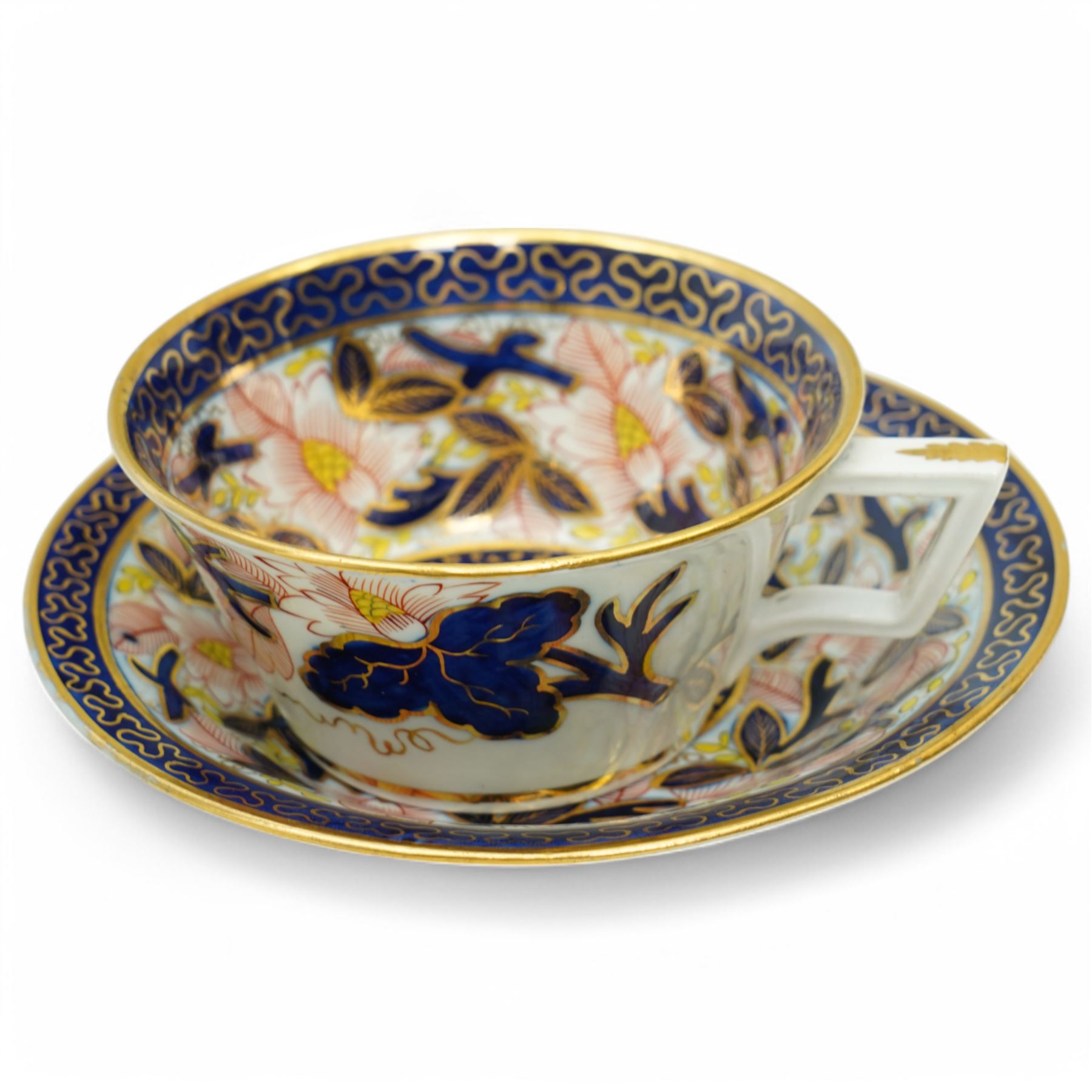 English porcelain Imari tea and coffee wares, pattern 1277, decorated with central orange floral motif surrounded by sprigs of yellow foliage within blue borders, comprising eleven teacups, eight coffee cups, twelve saucers, two shallow bowls and one finger bowl