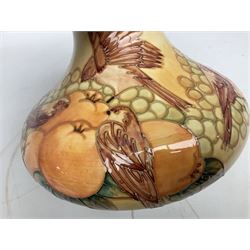 20th Century Moorcroft Finches pattern vase of squat form, upon a ochre ground, designed by Sally Tuffin, with impressed mark beneath, H21cm 
