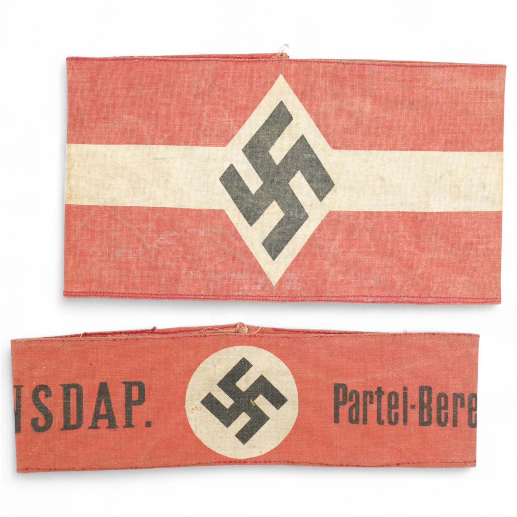 German WWI leather belt, the buckle marked 'Gott Mit Uns' surrounding a crown, a Third Reich webbing belt and buckle encircling eagle and swastika, NSDAP arm band and another