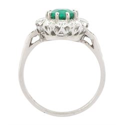 Platinum emerald and diamond cluster ring, single oval cut emerald of approx 0.90 carat, surrounded by ten round brilliant cut diamonds, and milgrain set diamond shoulders, stamped Plat, total diamond weight approx 1.00 carat