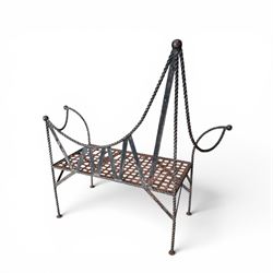 Victorian design wrought iron garden bench, with asymmetrical rope-twist frame, arched back and sides over out-swept arm terminals with ball finials, flanking a lattice seat, in antique black-painted weathered finish