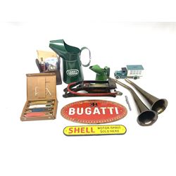 Bugatti cast iron sign with a red background, Shell Oil cast iron sign with gold background, together with Land Rover oil can, motorist warning lamp & torch tool kit and other motoring items 