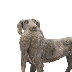 Bronze sculpture of a gundog retrieving a pheasant, finely cast with detailed coat and featherwork, mounted on a textured rectangular base