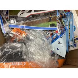 Very large collection of Lego, predominantly loose but some part constructed models, including Lego City, Lego Technic, Chima, Arctic 5, train set, mobile crane etc; together with numerous instruction booklets and some empty boxes; contained in two large cardboard boxes with gross weight of over 24kgs