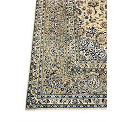 Central Persian Kashan carpet, decorated all-over with interlacing floral design, scrolling border with stylised plant motifs, with signed panel