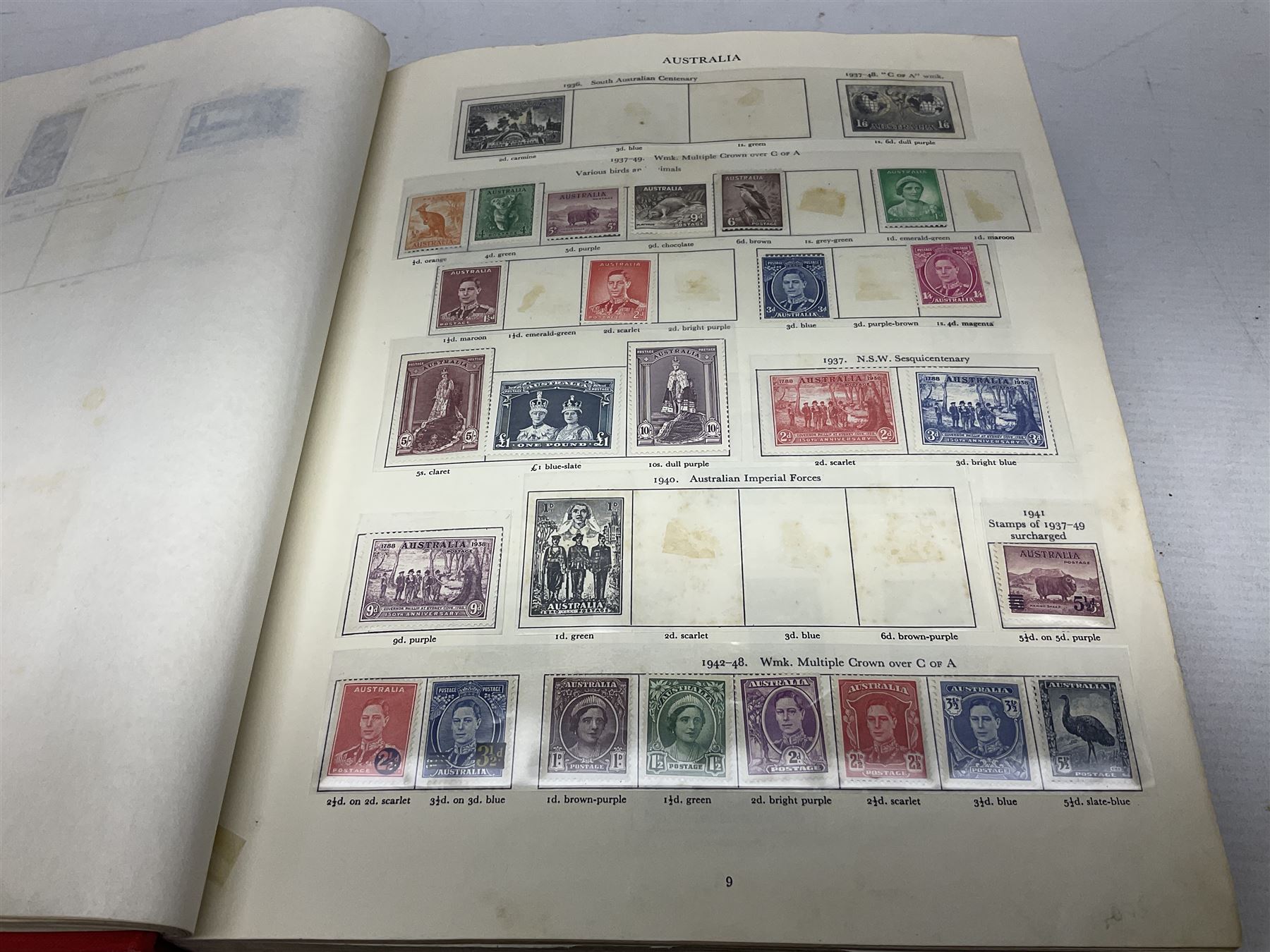 Single album collection of King George VI stamps, including Aden, Antigua, Ascension, Australia, Bahamas, Bahrain, Barbados, Basutoland, Bechuanaland, Bermuda, British Solomon Islands, Brunei, Burma, Cayman Islands, Dominica, Falkland Islands, Gambia, Gilbert and Ellice Islands, Gold Coast, Great Britain 1939-48 set to one pound including ten shilling dark blue, Grenada, Hong Kong, India, Ireland, Jamaica, Leeward Islands, Malta, Mauritius, New Zealand etc