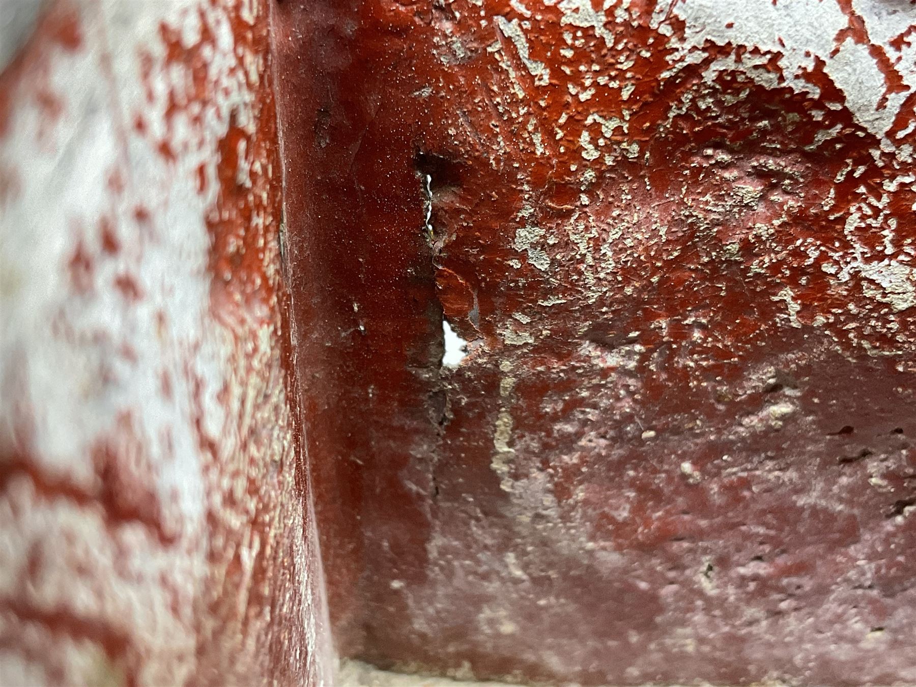 19th century lead tobacco box, the body of square form decorated with panels of courting couples in relief supporting stepped tapering lid with figural male head finial, H18.5cm