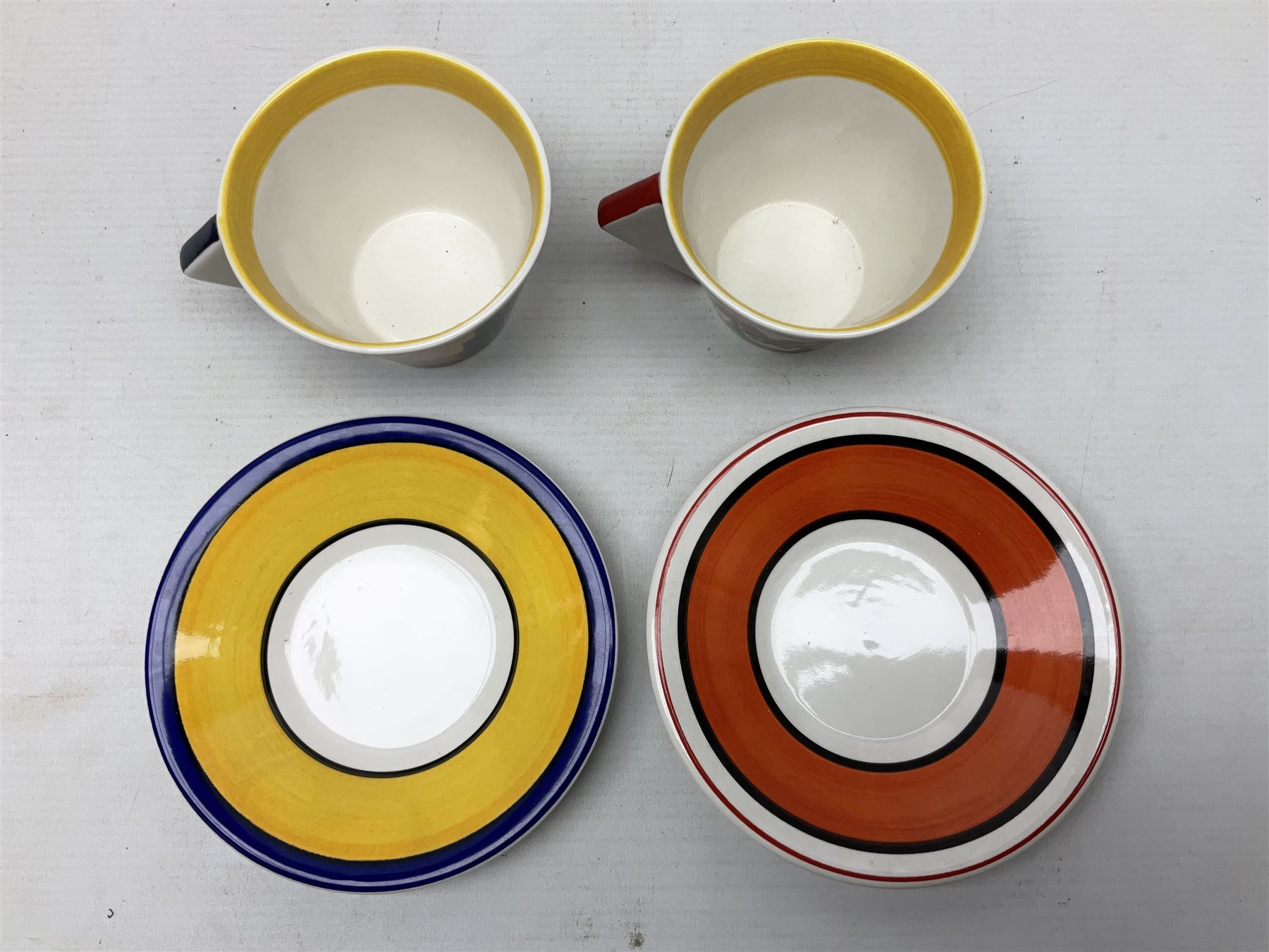 Wedgwood limited edition Clarice Cliff Design Taking Tea collection, comprising eight cups and saucers Honolulu, Apples, Gibraltar, Lilac Crocus, Trees and House, Coral Firs, Devon, and Sunray, with certificates of authenticity 