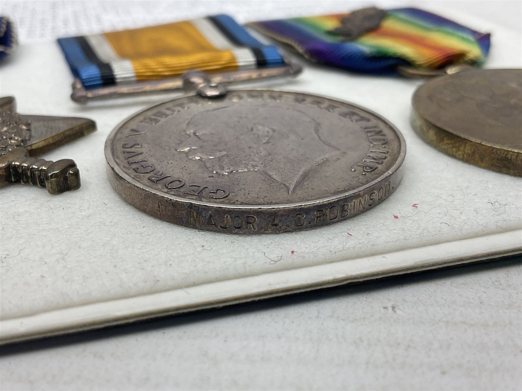 WWI Military Cross group of four awarded to Major Alfred Conrad Robinson South Lancashire Regiment and 3rd Battalion Nigeria Regiment Royal West African Frontier Force comprising MC, British War Medal and Victory Medal with oak leaf, and 1914-15 Star (to Lieut. A.C. Robinson); Military Cross London Gazette 4th June 1917. Bar to Military Cross (Capt. A.C. Robinson 3rd Bn. Nigeria Regt. RWAFF won a bar to his Military Cross (date of award 10th June 1917) for his action at Ngwembe German East Africa on 24th January 1917 for 'Handling his company with great judgement and coolness'. Recommended for a bar to his MC dated 10th June 1917 but never recorded (copy bar included with the medals).Mentioned in despatches on two occasions. Published in the London Gazette Supplements dated 31st May 1916 by Brig-Gen F.J. Cunliffe, commanding Allied Forces Northern Cameroons to the Rt.Hon. A. Bonar Law MP P.C. Secretary of State for the Colonies, H.Q. Nigeria Regiment, Lagos, 16th March 1916; and again London Gazette Supplement 7th March 1918 from Major-Gen A.R. Hoskins C.M.G. D.S.O. Late Commander-in-Chief East Africa Force to the Secretary of Stae for war 5th March 1918; together with an extensive archive of research information and the original bill of purchase from Spink & Son dated 4/11/1959