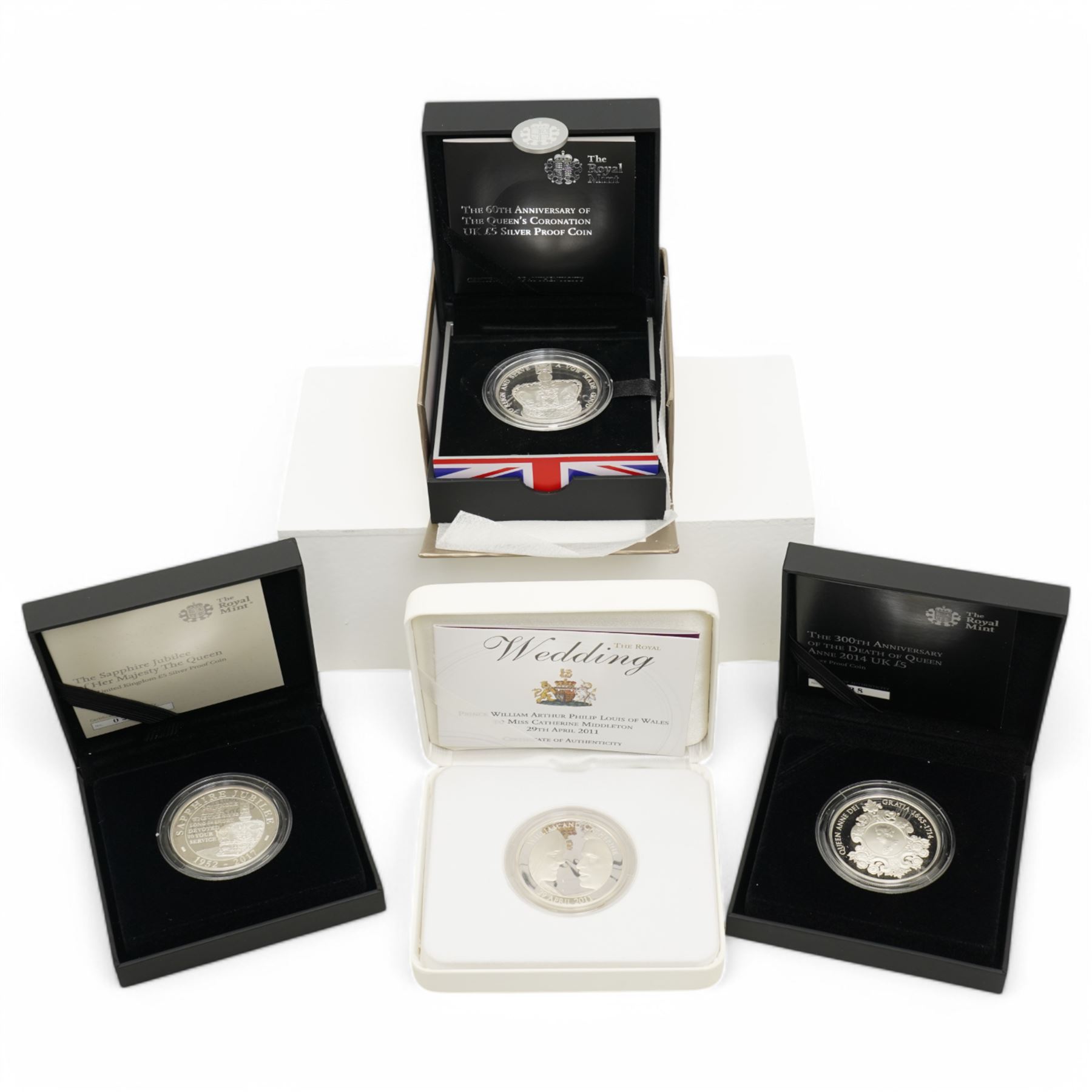 Four The Royal Mint United Kingdom silver proof five pound coins, comprising 2011 'The Royal Wedding', 2013 'The 60th Anniversary Of The Queen's Coronation', 2014 'The 300th Anniversary Of The Death Of Queen Anne' and 2017 'The Sapphire Jubilee Of Her Majesty The Queen', all cased with certificates