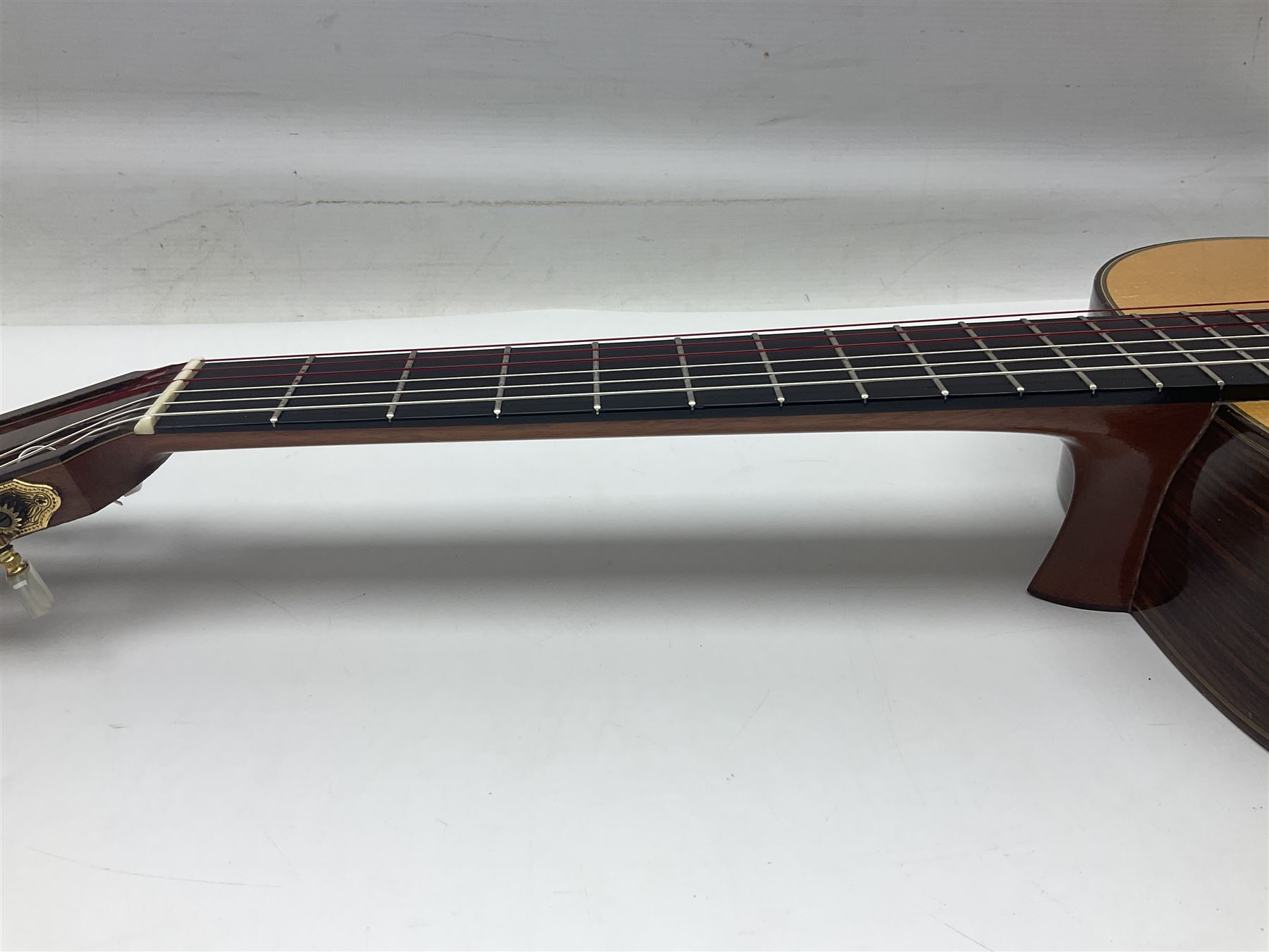 British hand made classical acoustic guitar by Huw Morgan with Indian rosewood back and sides and spruce top; bears label dated May 1998; L100cm; in Tribal Planet lightweight carrying case