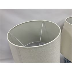 Pair of Chinese table lamps of baluster form, each decorated with landscape scene, raised upon gilt circular base, including shade H63cm