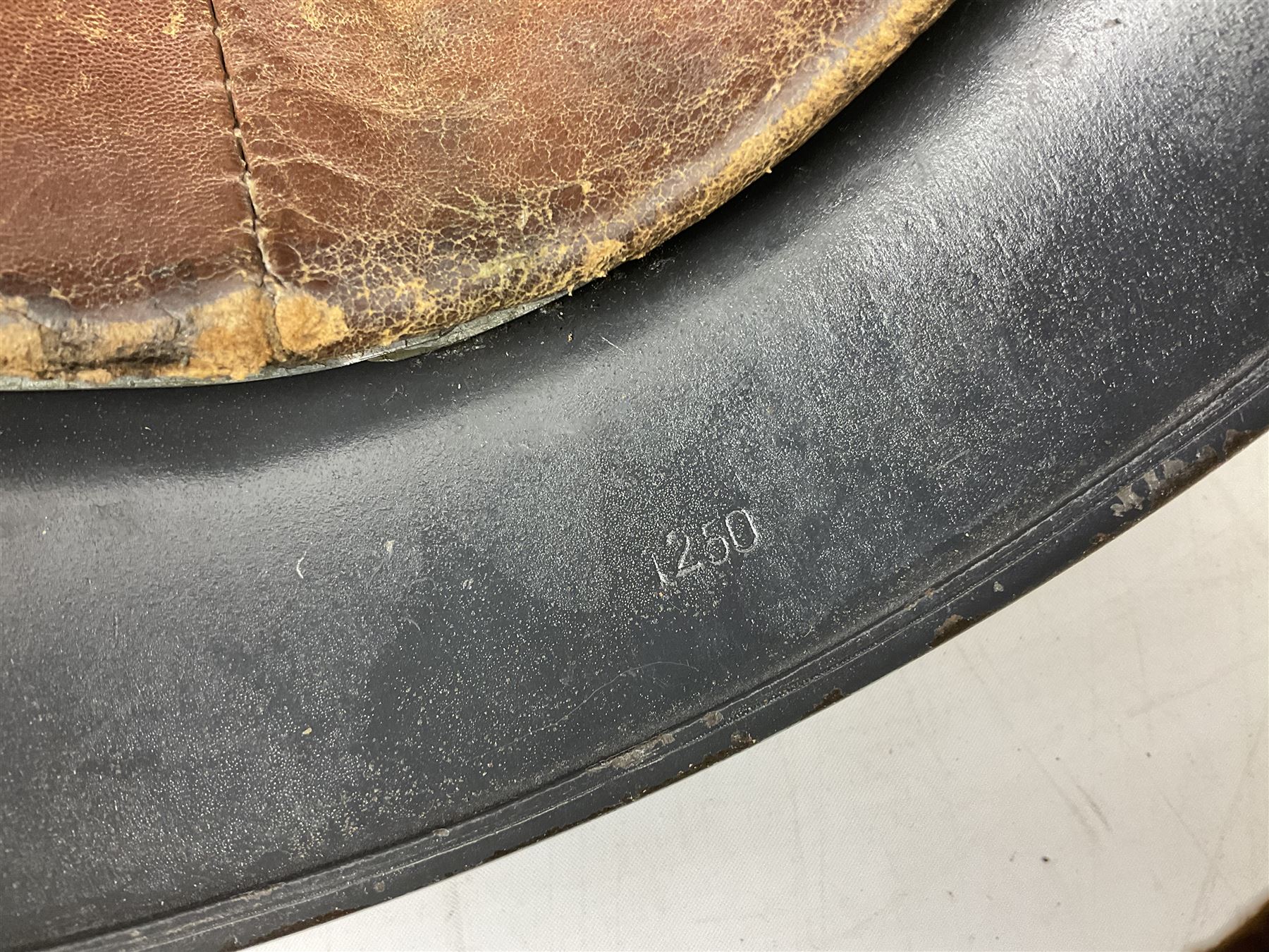 WW2 German steel helmet painted in undecaled Luftwaffe bluey grey with leather liner and chin strap stamped '58', the skirt impressed '1250'