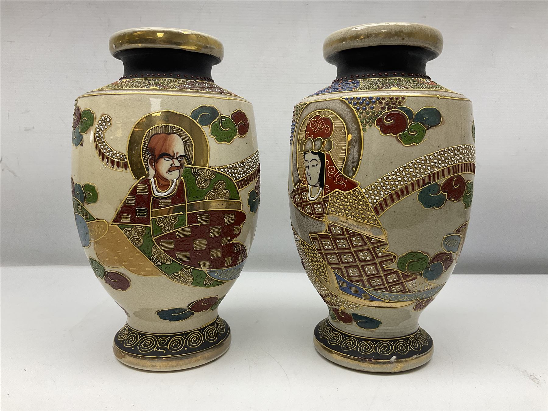 Pair of early 20th century Japanese Satsuma vases, decorated with immortals, with painted mark to base, H26cm