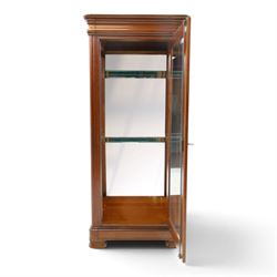 Barker & Stonehouse - cherrywood glazed cabinet, moulded projecting cornice glazed panels to the front and sides, mirrored back with adjustable glass shelves, moulded plinth base above short bun feet