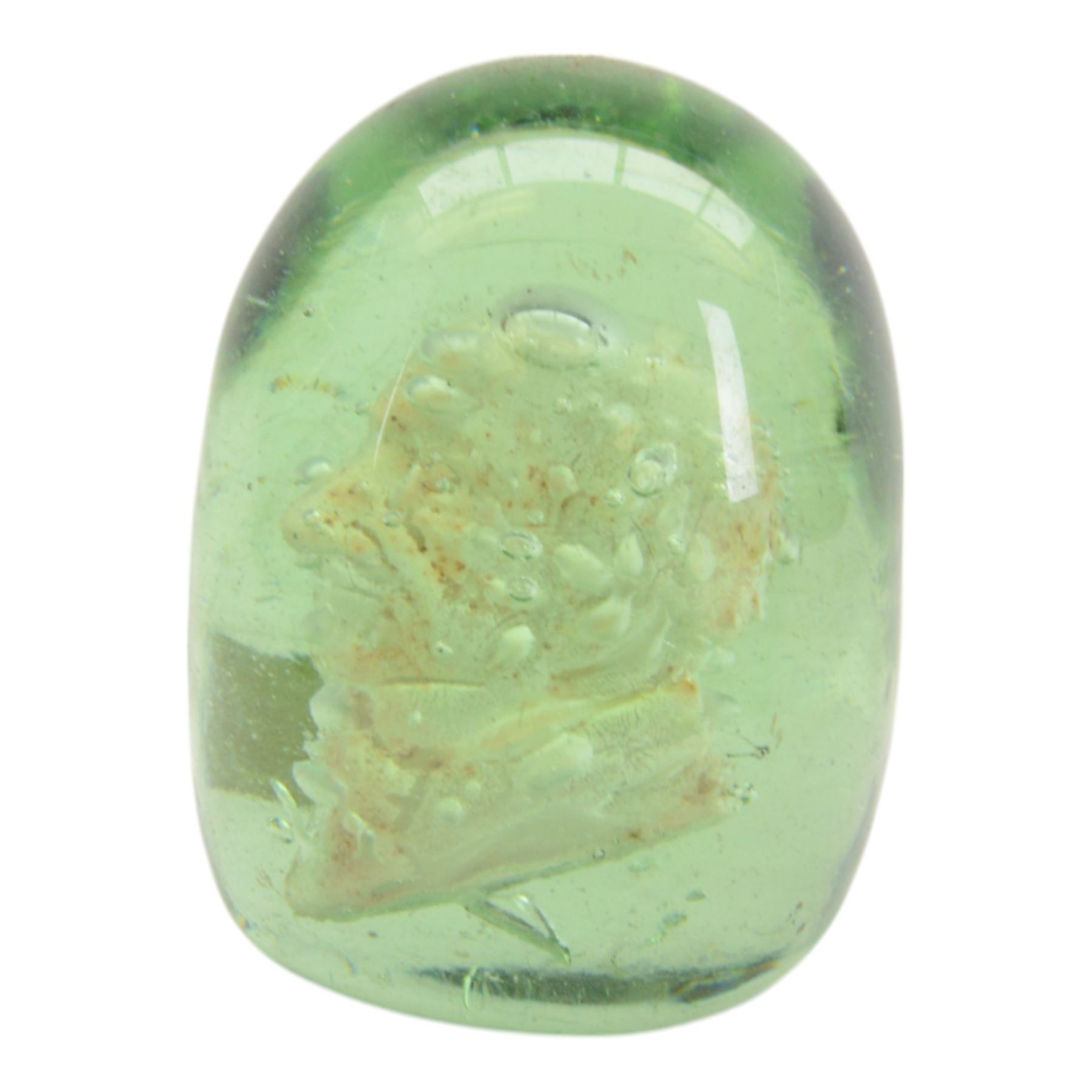 Three Victorian green glass dumps, two internally decorated with a bust profile of William Ewart Gladstone and one with a medallion to the centre, tallest H10cm