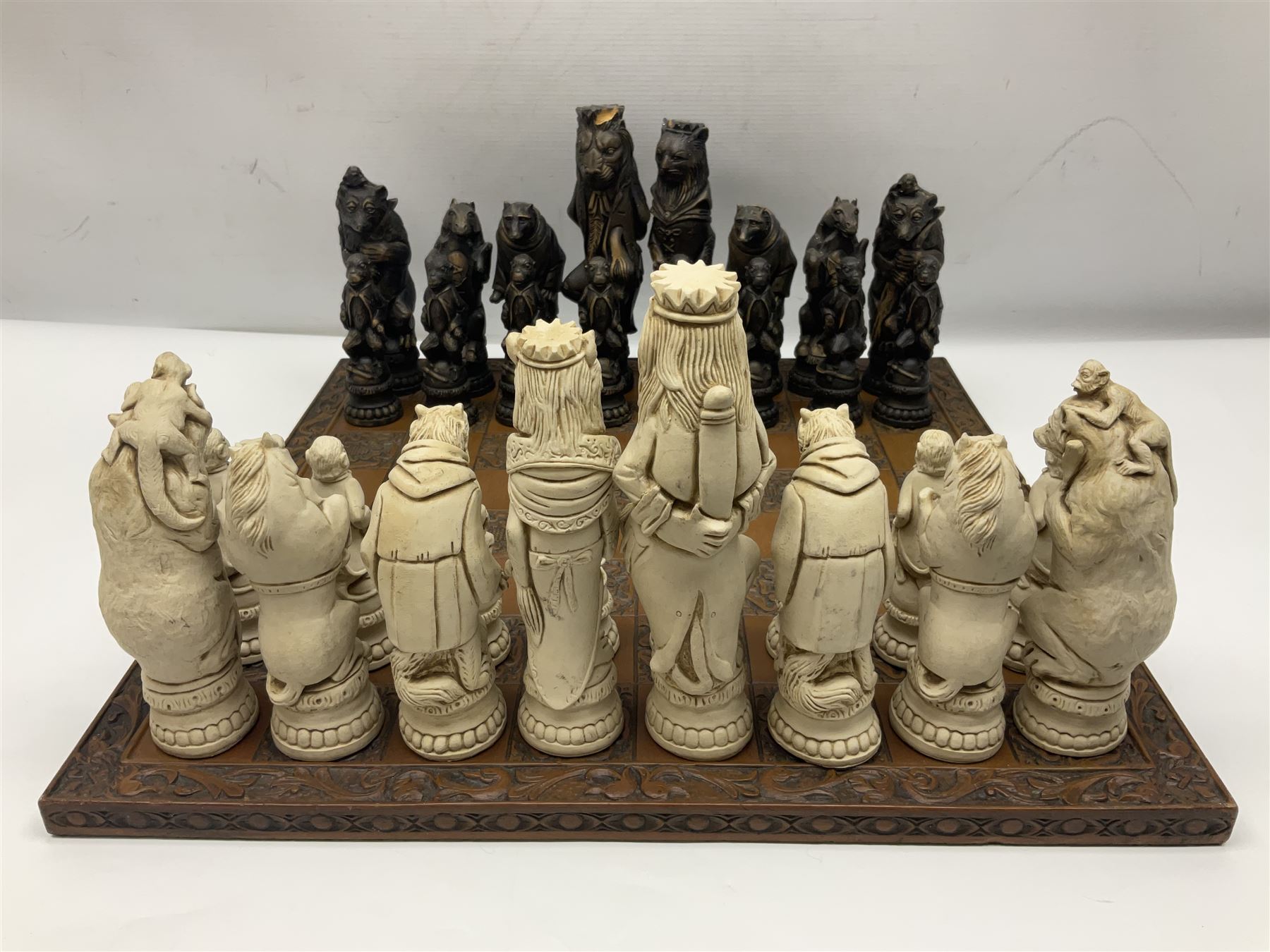 Chess set and resin chess pieces moulded as various animals, the pawns as monkeys, Kings as lions etc, board L46cm, W46cm, king H19cm