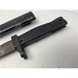 British No 7 MKI knife bayonet with 20cm single edged fullered clipped point blade;  blackened steel, large muzzle ring cross-guard; blackened swivelling pommel marked 'F5H'; red Tufnol composite grips; in blackened steel scabbard L33cm overall; British Pattern 1888 bayonet with scabbard; and German Ersatz bayonet with scabbard (3)