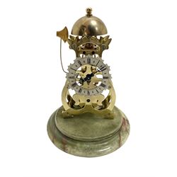 Thwaites & Reed - Small 20th century skeleton clock with a glass dome and stepped onyx base,  pierced movement frames with a silver chapter ring, Roman numerals, minute markers, and steel hands, domed brass bell with passing strike on the hour, with a lever platform escapement, wound and set from the rear. With key.