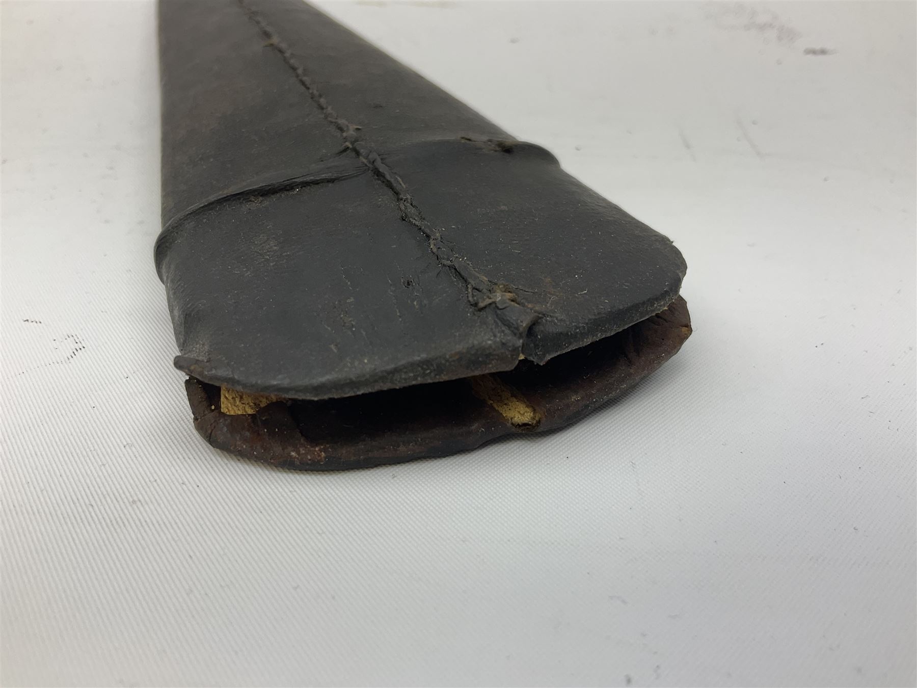 Indian thrusting dagger Katar the 25cm blade with swollen point and central rib, in leather covered wooden sheath L45cm overall