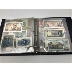 World banknotes, including Queen Elizabeth II The States of Jersey one pound 'DB202703', five pounds 'BB527762' and ten pounds 'AB651481', reserve bank of New Zealand two dollars '1L3 741894', King George V Straits Settlements one dollar 1st January 1935 'F/83 28924', various Bank of England notes etc, housed in two ring binder albums