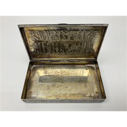 White metal box, possibly Libyan silver, with engraved foliate decoration to body, and embossed figural scenes to hinged cover, with impressed marks beneath