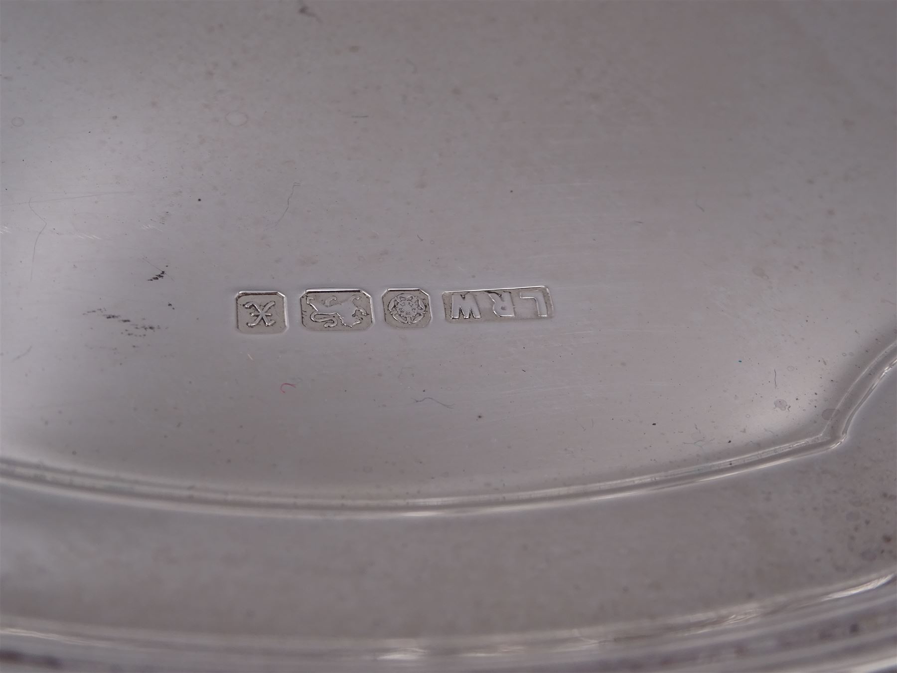 Modern silver salver, with shaped pie crust rim, upon four scroll feet, hallmarked L R Watson, Sheffield 1997, D21cm