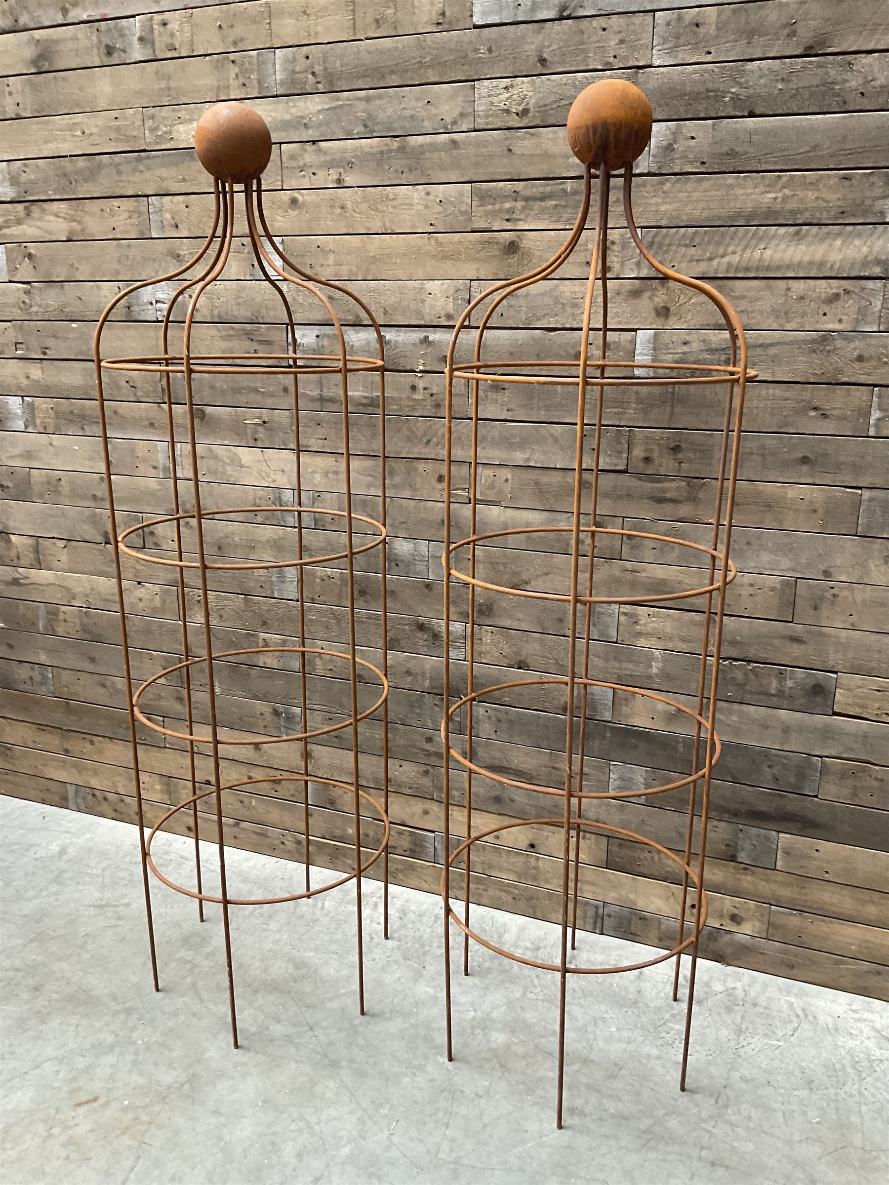 Pair of Country House wrought iron garden obelisks with ball finial, raise in four tiers