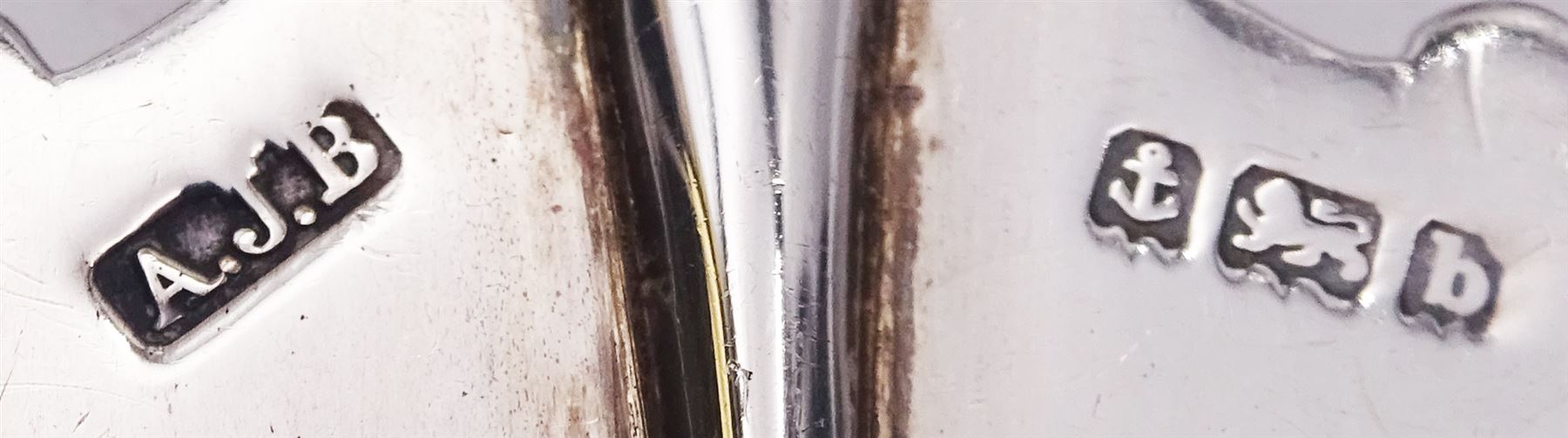 Edwardian silver and mother of pearl handled four piece afternoon tea set, comprising bread trident, pickle fork, preserve spoon, and butter knife, each with foliate engraved detail to prongs, blade and bowl, hallmarked A J Bailey, Birmingham 1901