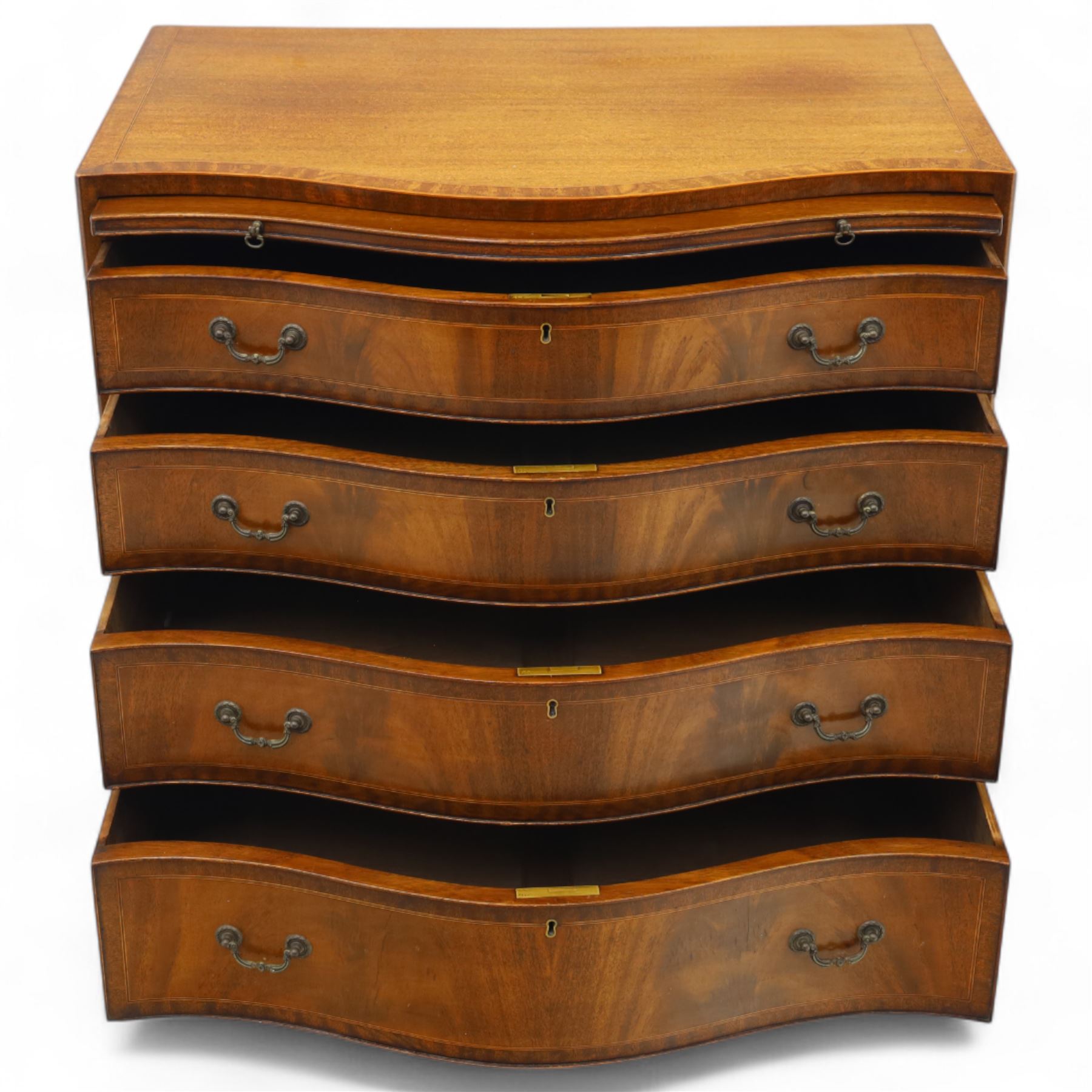 Early 20th-century Georgian design mahogany serpentine chest of drawers, rectangular-shaped top over a brush slide, and four long graduated drawers with brass swan neck handles, serpentine-shaped apron, raised on splayed front feet 