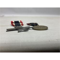 Two WW1 German medals - copy Cross of Honour with swords (combatants); Cross of Honour without swords (non-combatants); and two WW2 German medals - War Merit Medal; and War Merit Cross; all with ribbons (4)