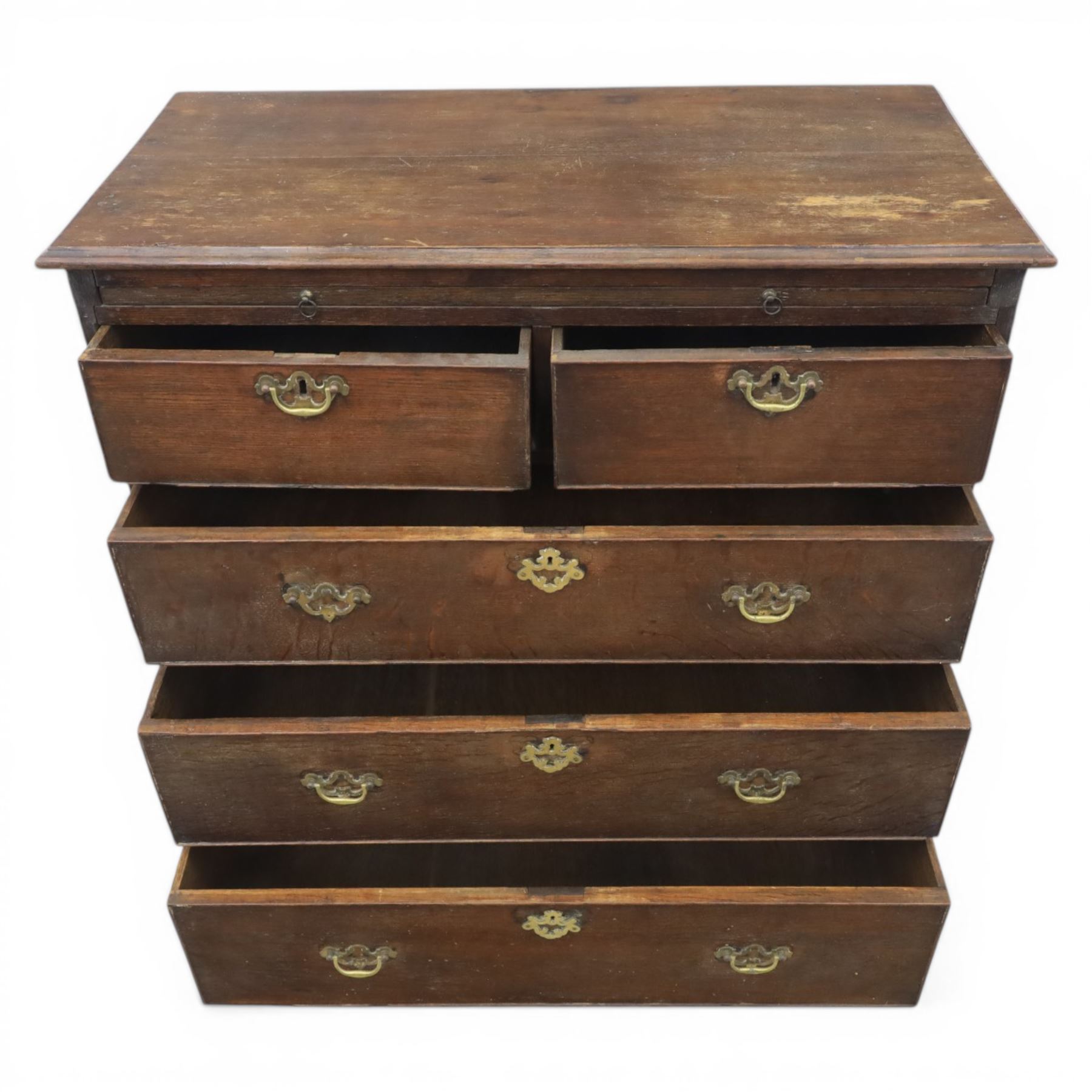 18th century oak chest, rectangular top with moulded edge, fitted with five drawers and baize line slide, with swan neck brass handles, raised on bracket feet