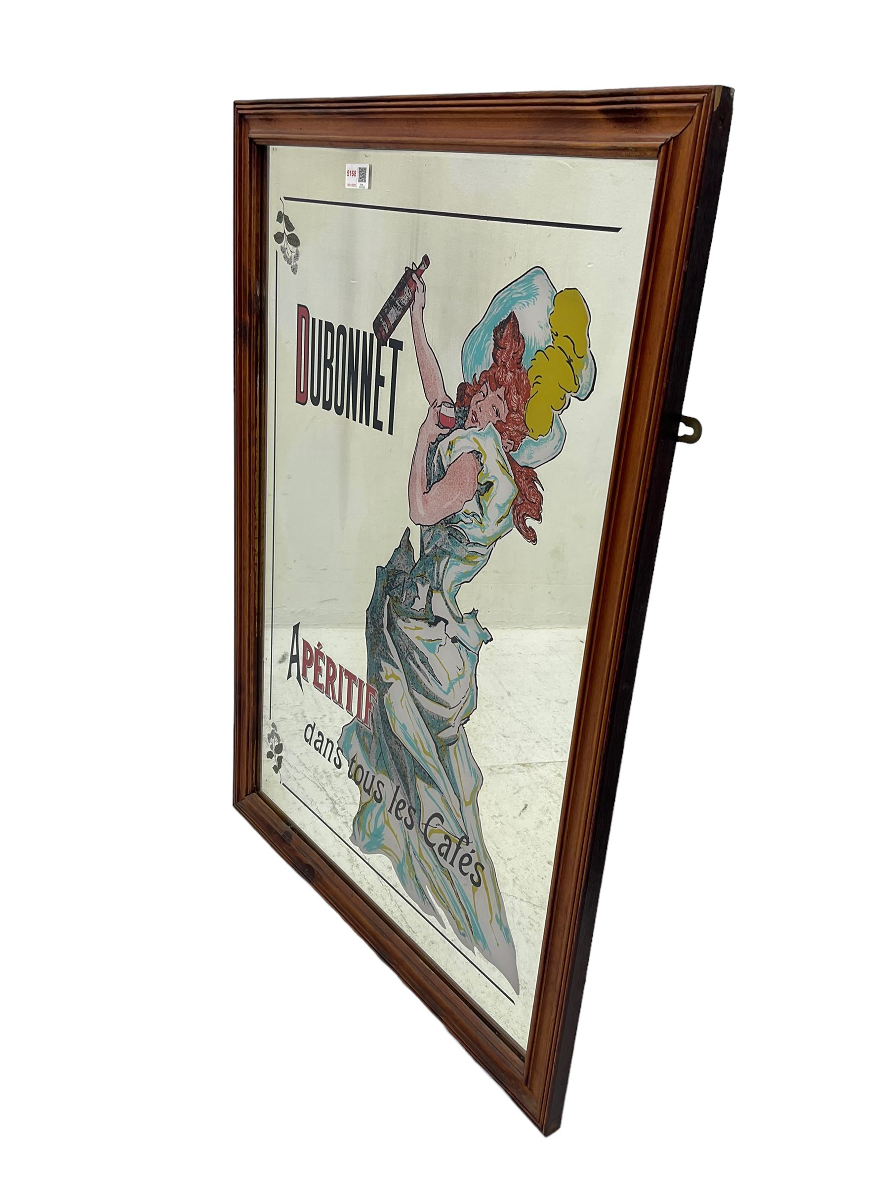 Vintage Dubonnet advertising mirror decorated with image of lady holding a bottle, in wood frame, 89x63cm