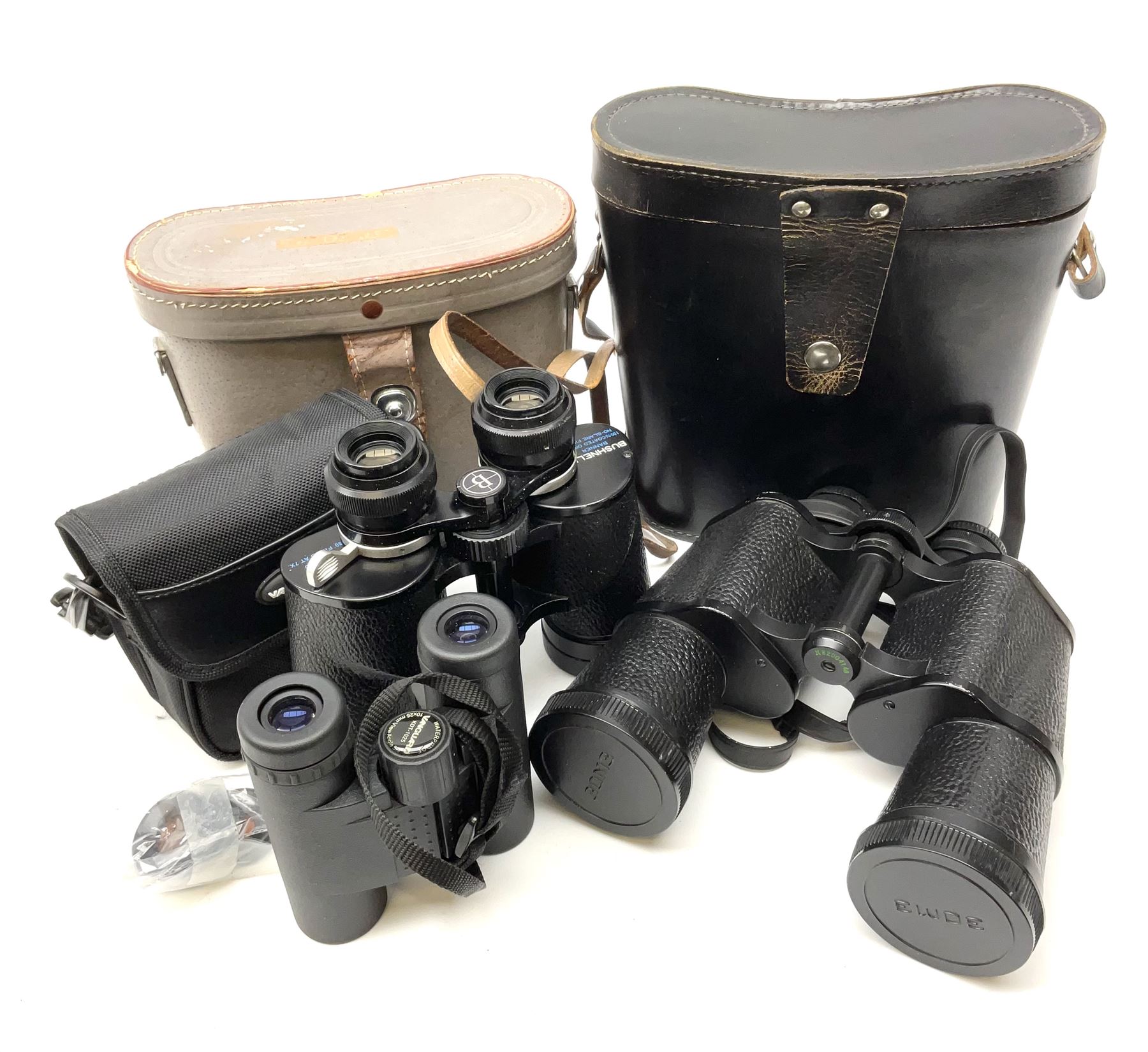 Pair of Russian USSR 6NU 7 x 50 binoculars with two pairs of light filters no.N82004148; pair of Bushnell Banner 7-12 x 35 zoom binoculars no.JR1698; and pair of Vanguard KDT-1025 10 x 25 waterproof binoculars no.F0710186; all cased (3)