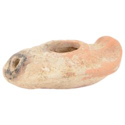 Antiquities; two decorative terracotta Byzantine oil lamps, 4th - 5th century, with decorative spouts, together with two similar examples