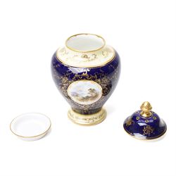 Coalport pot pourri jar and cover, circa 1920, the dark blue ground painted with landscape panels of Helvelly by E.O. (Ted) Ball, printed and painted marks to base, H17cm