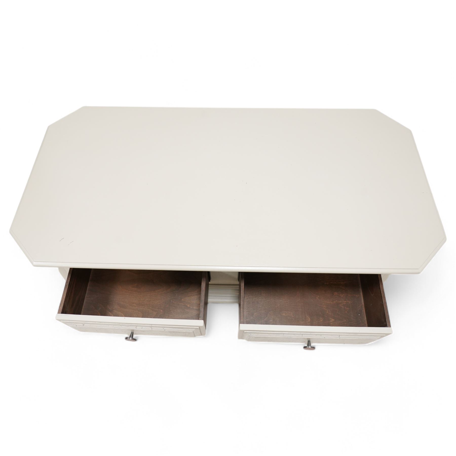 Light grey painted low coffee table, canted rectangular form fitted with two through drawers, on compressed bun feet