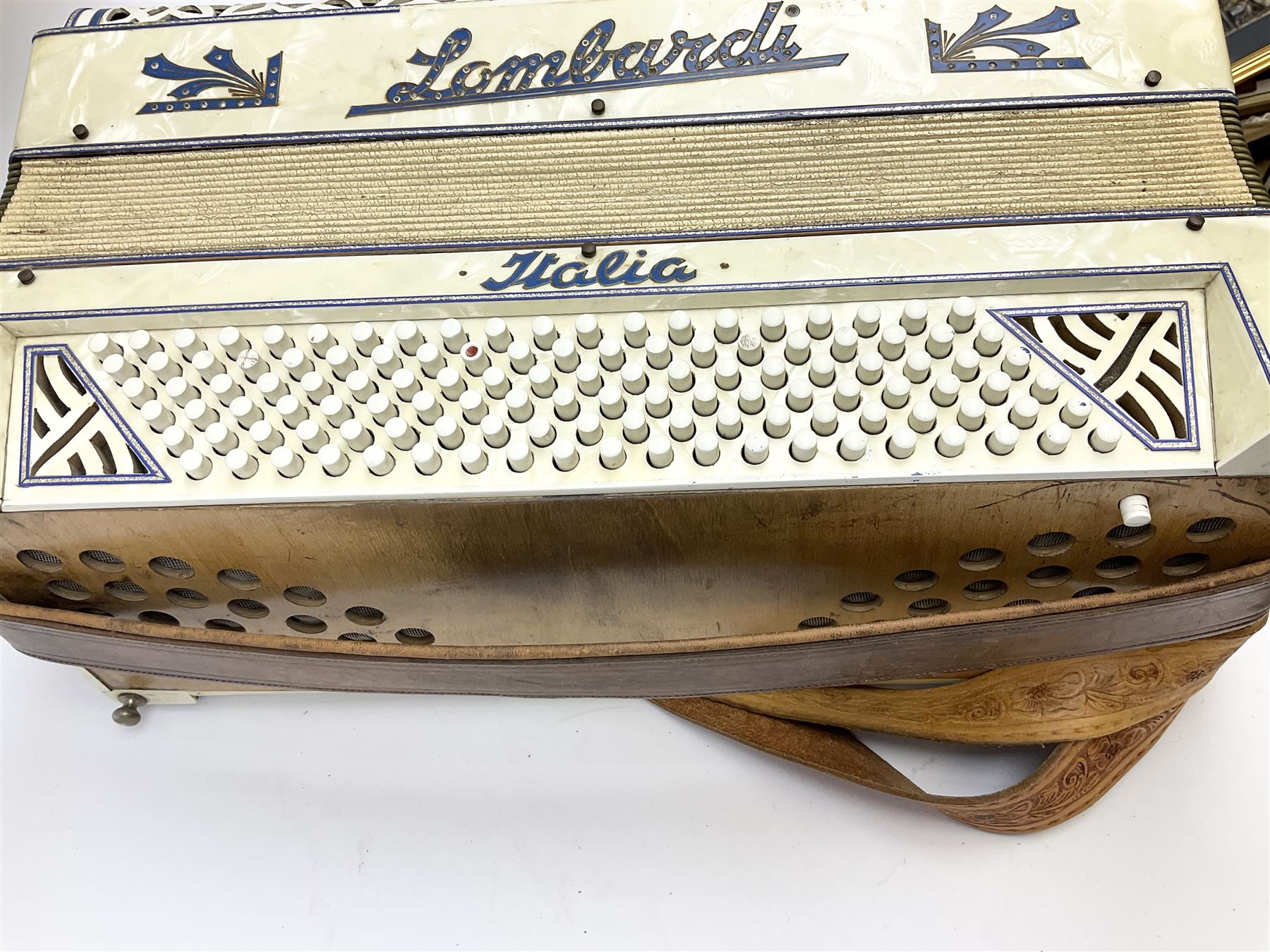 Italian Lambardi piano accordion in ivory coloured pearline case with jewelled decoration, twenty keys and one-hundred and twenty buttons L 37cm