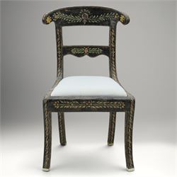 Early 20th century Anglo-Indian painted and inlaid armchairs, each with shaped top rail decorated with polychrome floral motifs above turned spindle galleries, shaped open arms and upholstered seats, on square supports with similar painted decoration