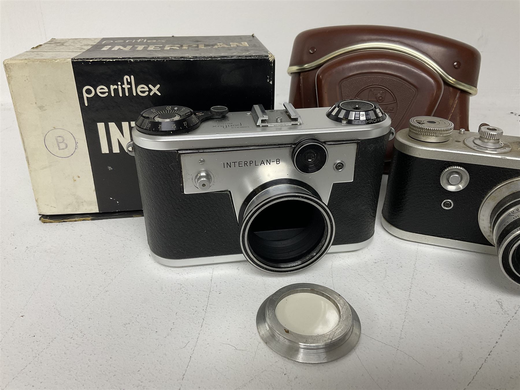 Corfield Periflex I 35mm periscope camera body,  with 'Corfield Lumar-X 1:3,5/50' lens, and Corfield Interplan-B camera body, serial no. 9111482 in original box, and with ready case